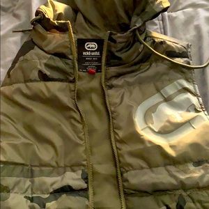A green no sleeve puffer.